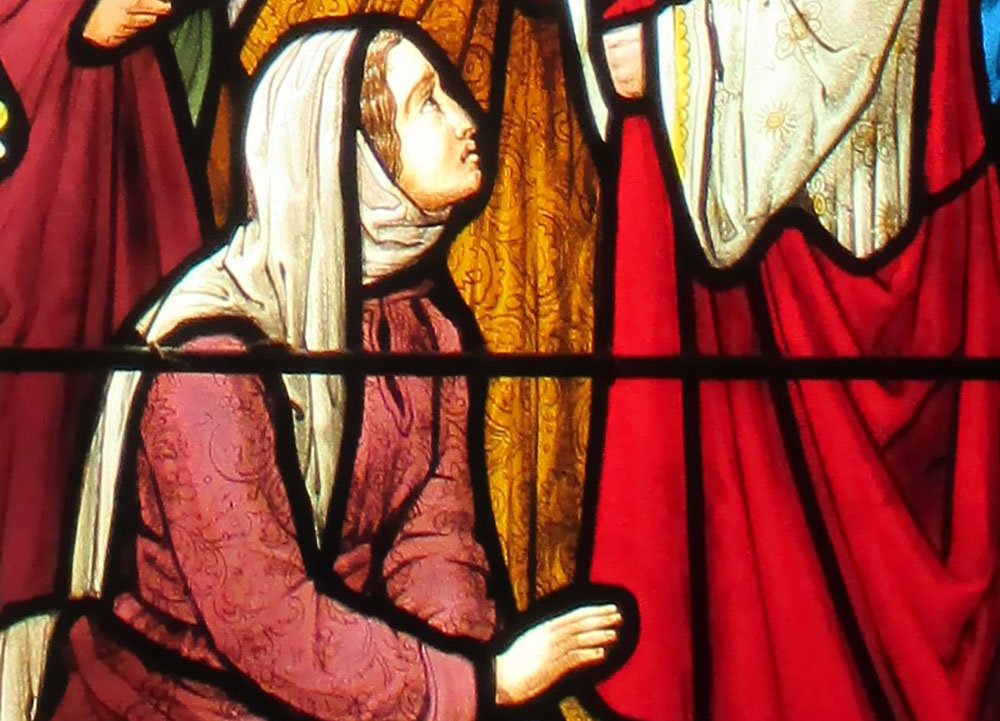 The woman touching Jesus' cloak, depicted in stained glass at St. Andrew's Church, Nuthurst, West Sussex, England (Wikimedia Commons/Antiquary) The woman touching Jesus' cloak, depicted in stained glass at St. Andrew's Church, Nuthurst, West Sussex, England (Wikimedia Commons/Antiquary)